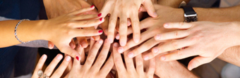 Team hands stacked showing teamwork